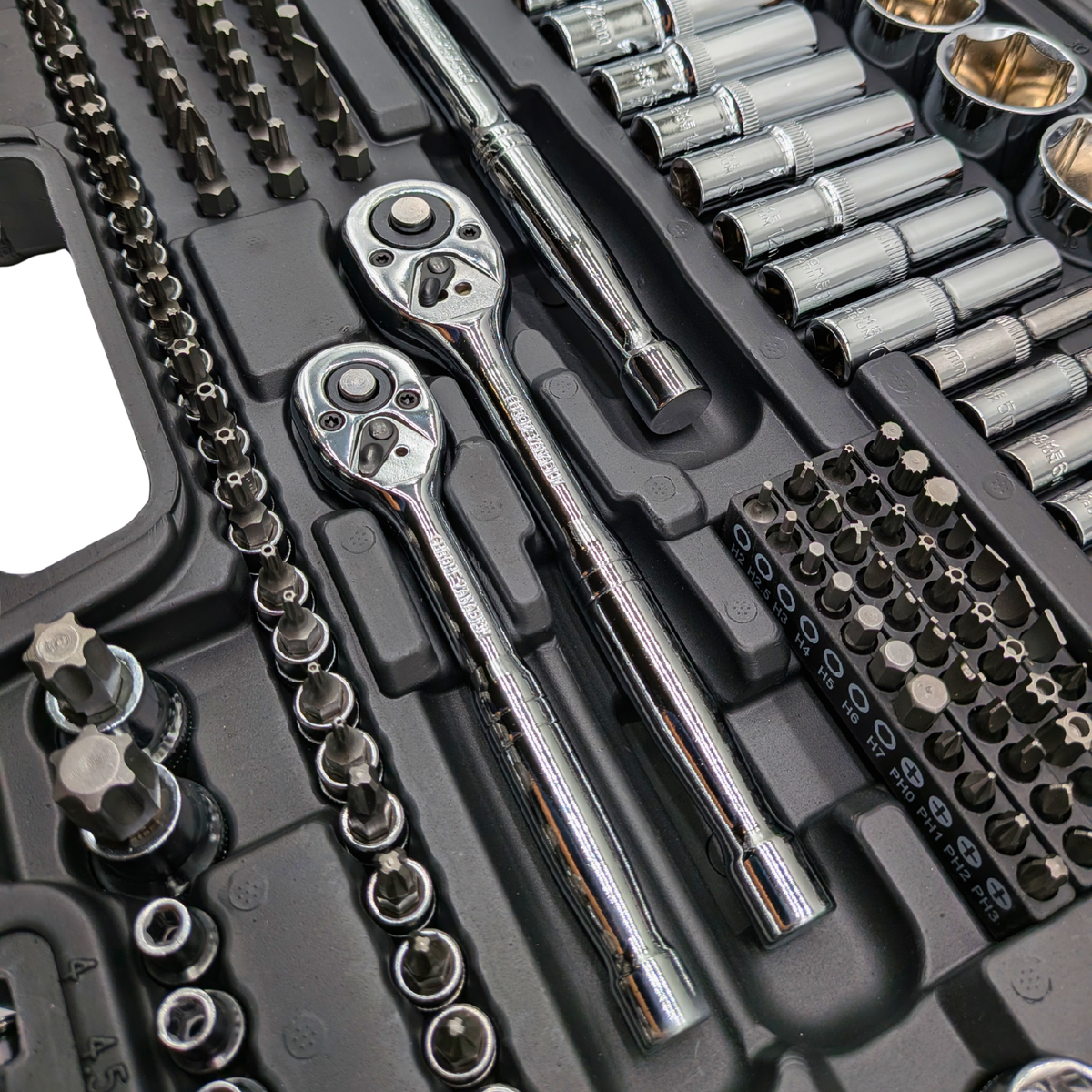 Close-up of chrome ratchets, sockets and bit holders in the IRONVOLT 218-piece tool set.